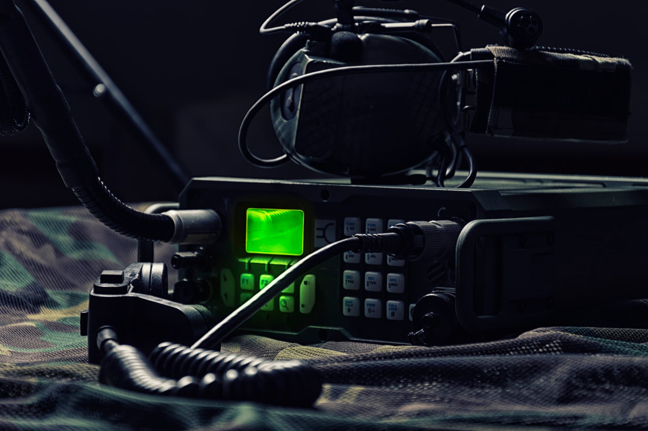 Modern military radio station setup with digital transmission overlays